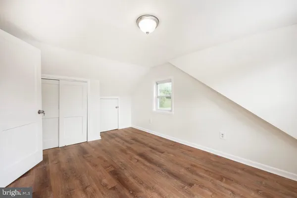 a bathroom with a sink toilet and a mirror