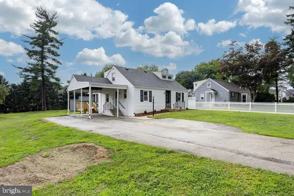 a front view of house with yard and patio