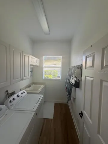 a bathroom with a sink and a window