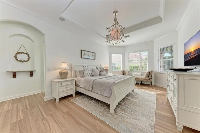 a spacious bedroom with a bed and window