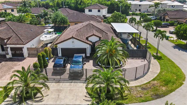 an aerial view of a house with a garden and plants