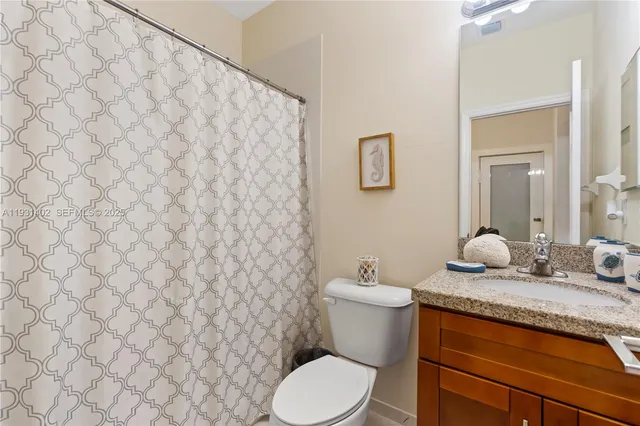 a bedroom with a bed and flat screen tv