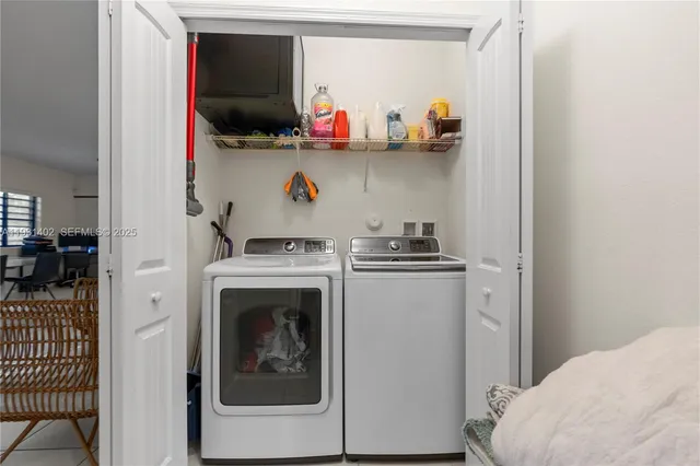 a utility room with dryer and washer