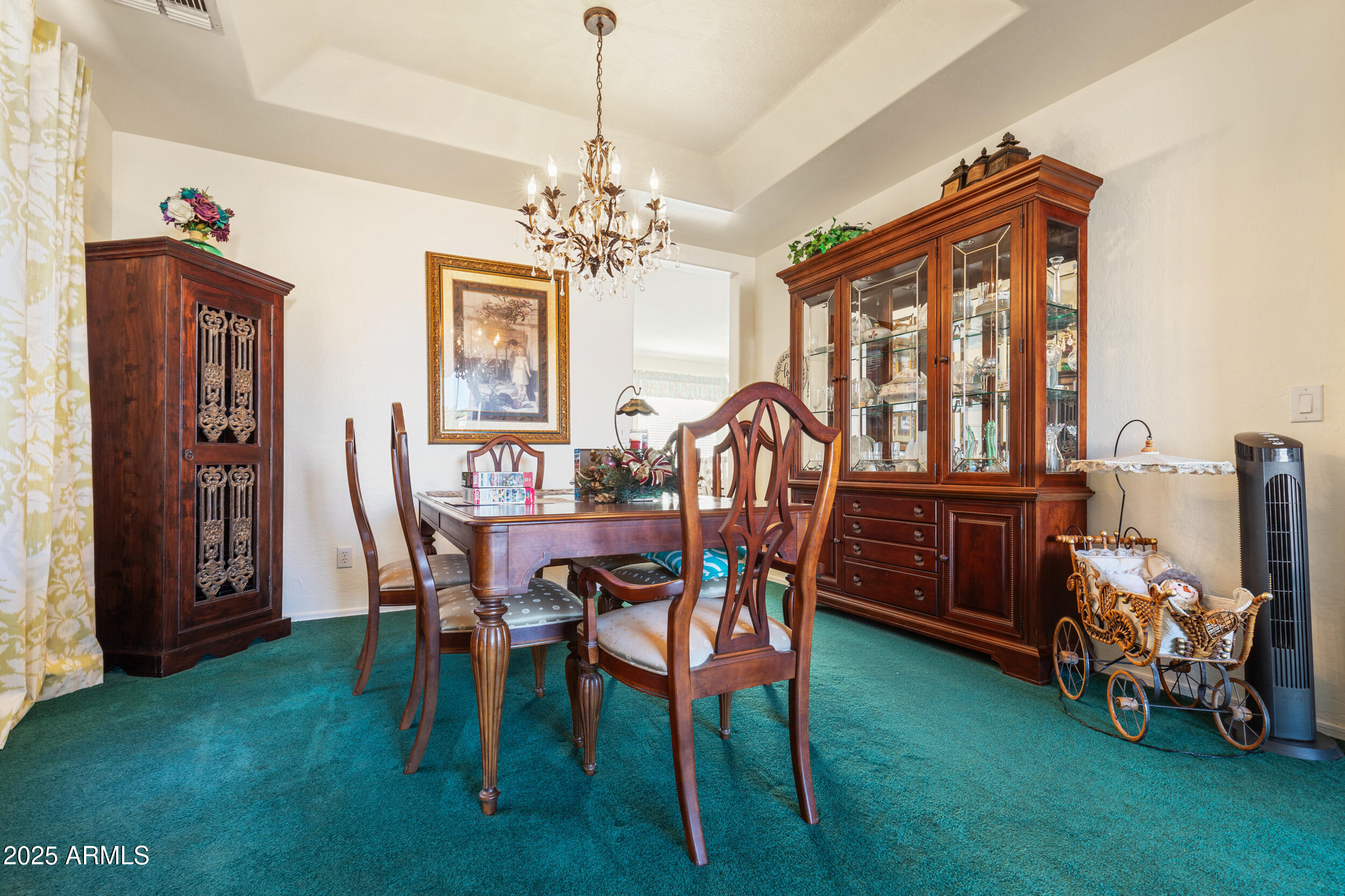 2821 East Nunneley Road Gilbert, AZ 85296 - Photo 11 of 51 a view of a dining room with furniture and chandelier
