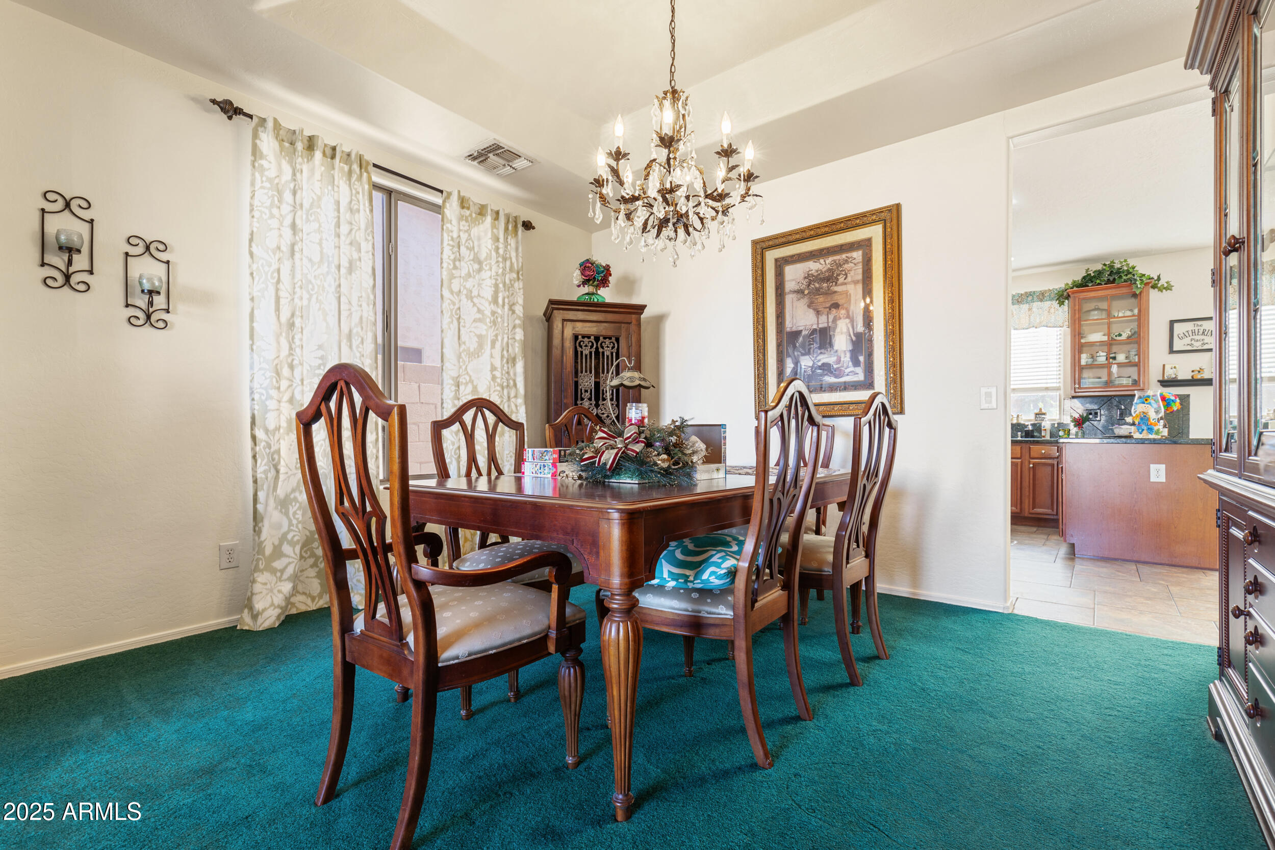 2821 East Nunneley Road Gilbert, AZ 85296 - Photo 12 of 51 a view of a dining room with furniture and chandelier