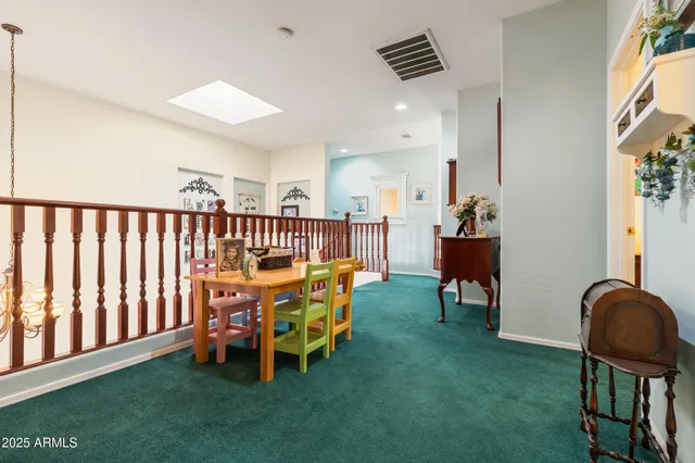 a bed room with a bed and a chair