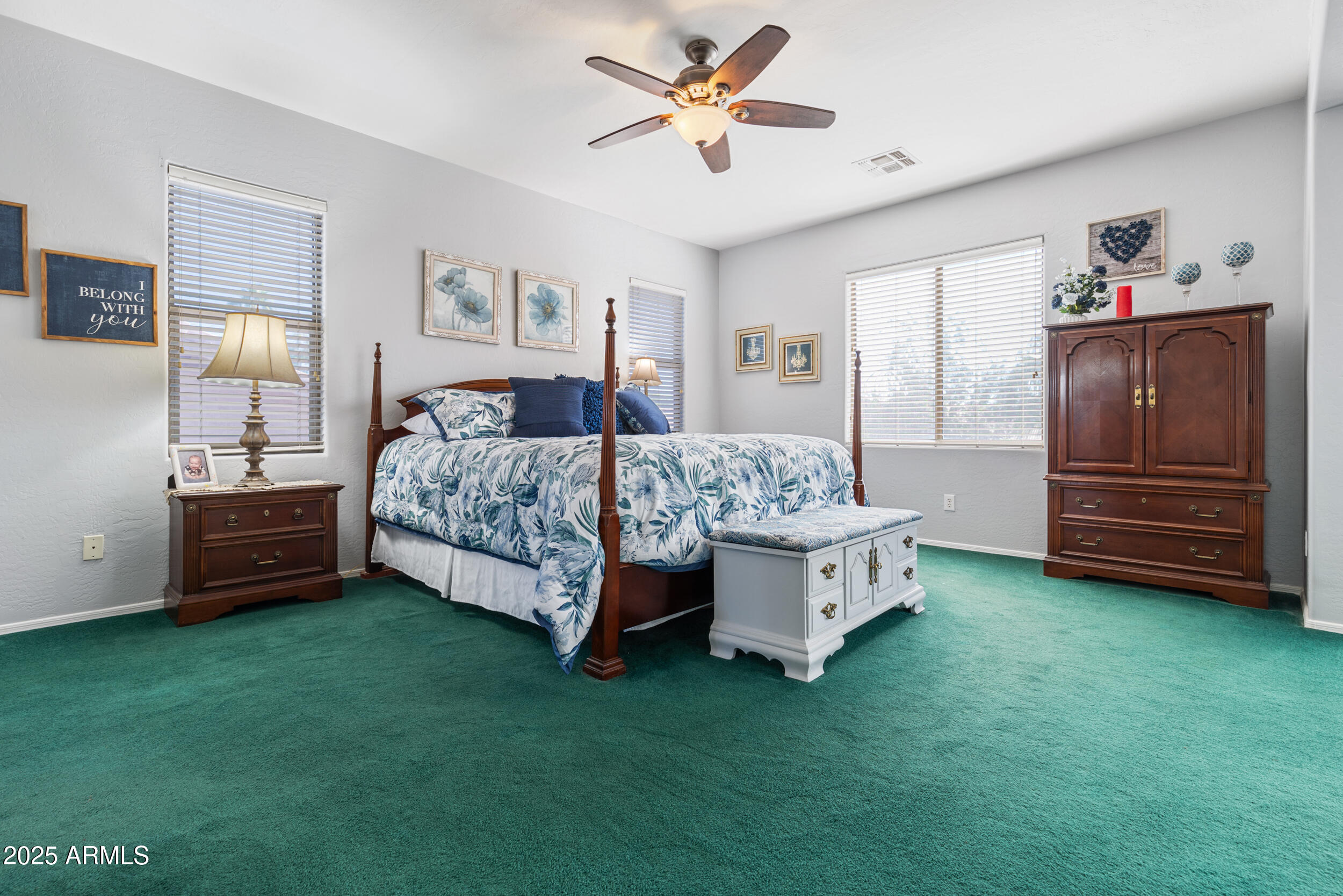 2821 East Nunneley Road Gilbert, AZ 85296 - Photo 32 of 51 a bed room with a bed and a ceiling fan