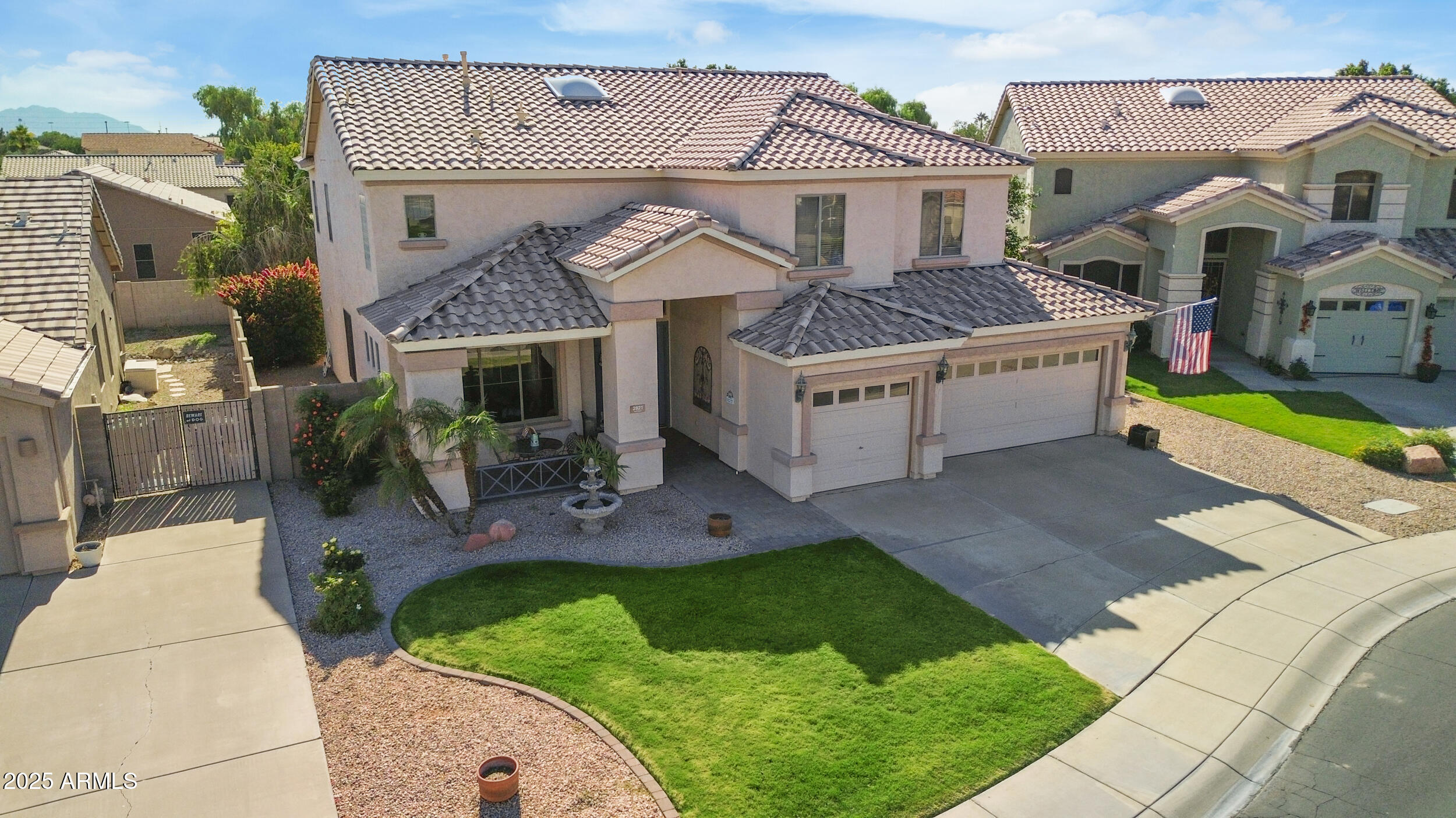 2821 East Nunneley Road Gilbert, AZ 85296 - Photo 43 of 51 a front view of a house with a garden and plants
