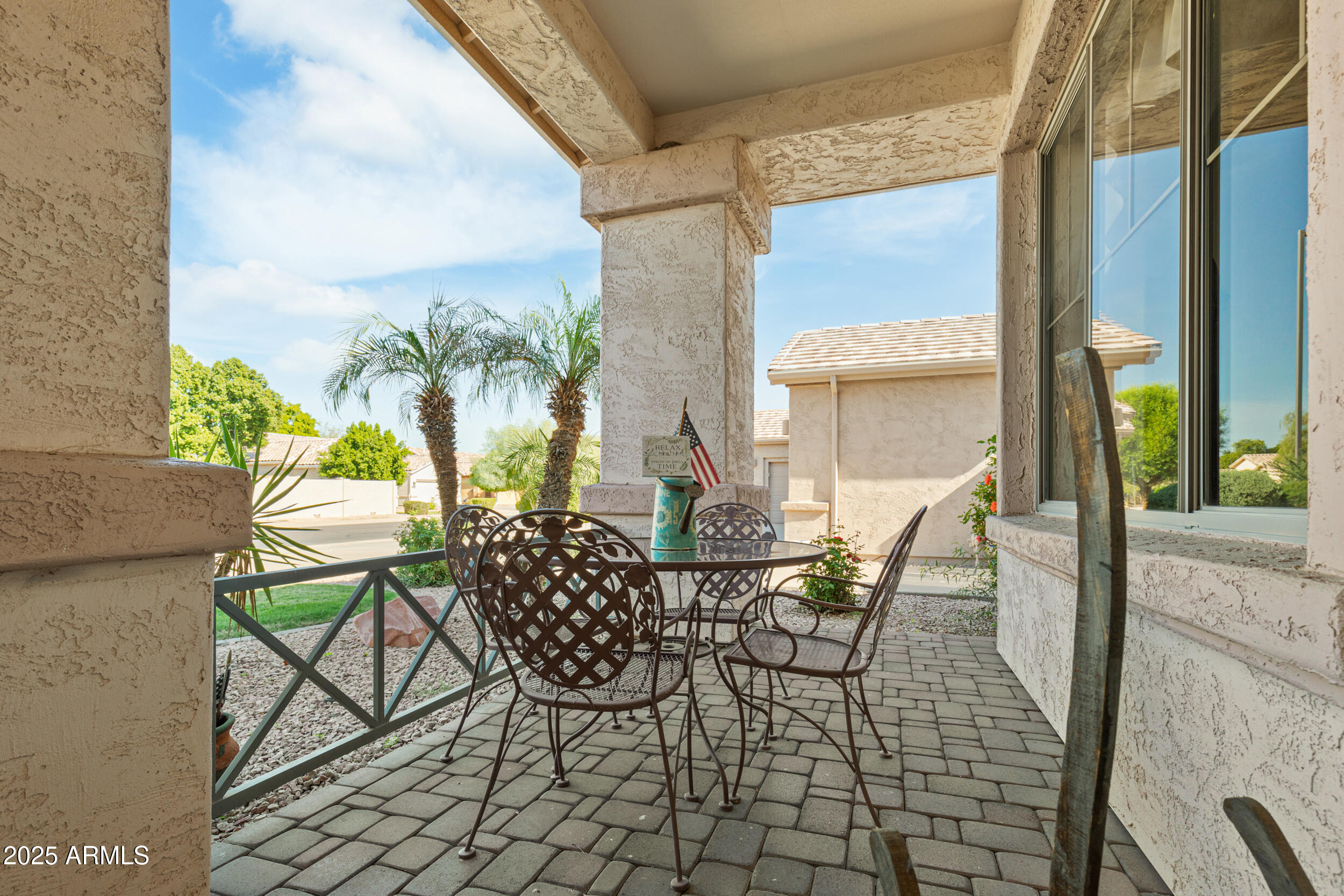 2821 East Nunneley Road Gilbert, AZ 85296 - Photo 6 of 51 a view of a dining room with furniture and a floor to ceiling window