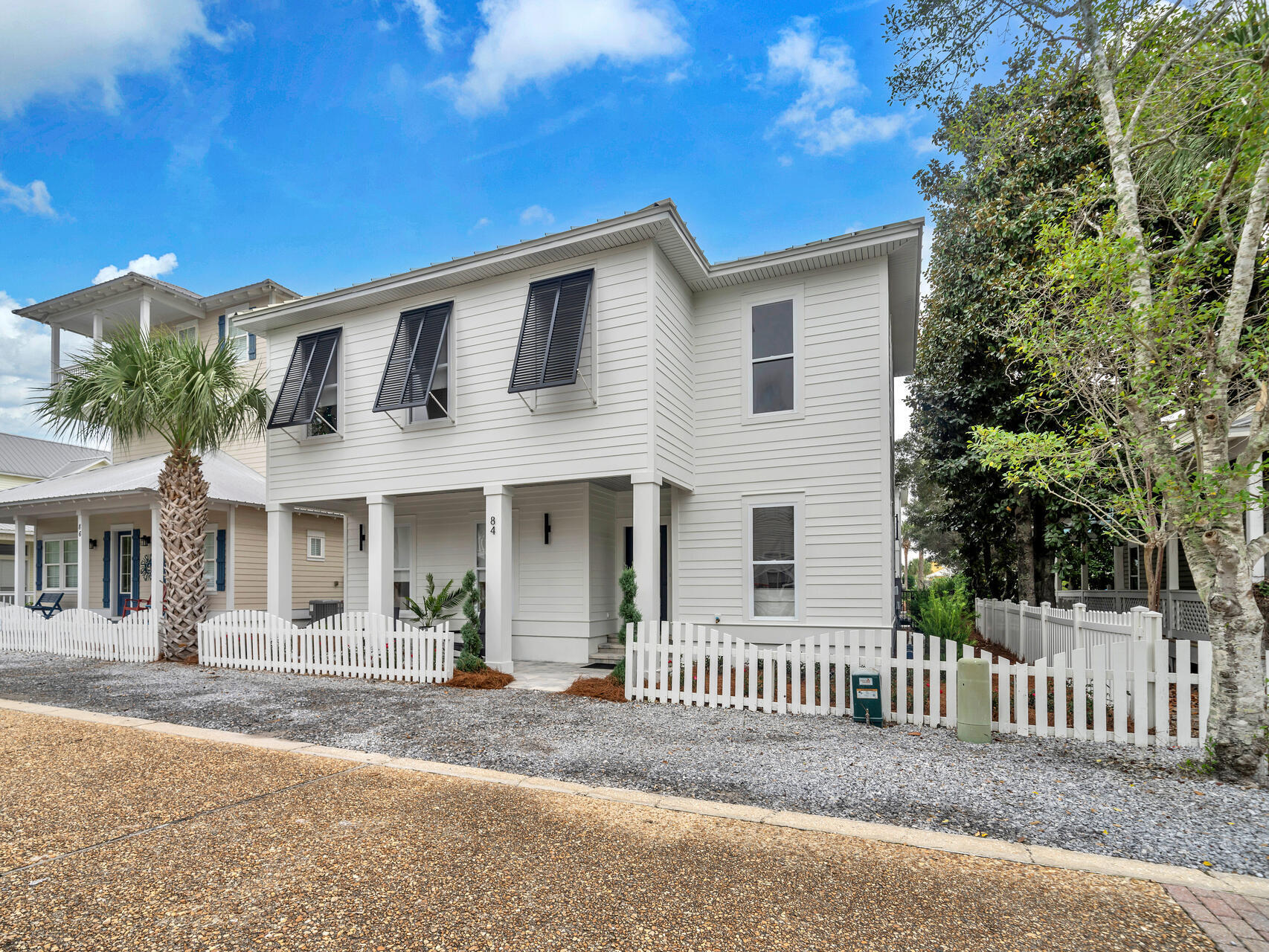 84 Mark Street Destin, FL 32541 - Photo 2 of 81 a front view of a house with a porch