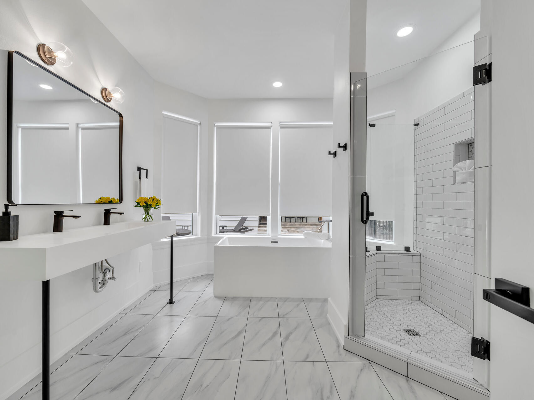 84 Mark Street Destin, FL 32541 - Photo 24 of 81 a bathroom with a tub sink mirror and shower