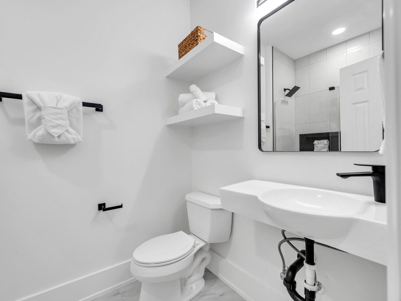 84 Mark Street Destin, FL 32541 - Photo 38 of 81 a bathroom with a sink a toilet and a mirror