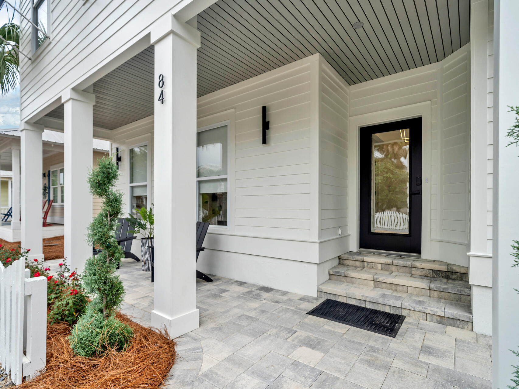 84 Mark Street Destin, FL 32541 - Photo 4 of 81 a front view of a house with a porch