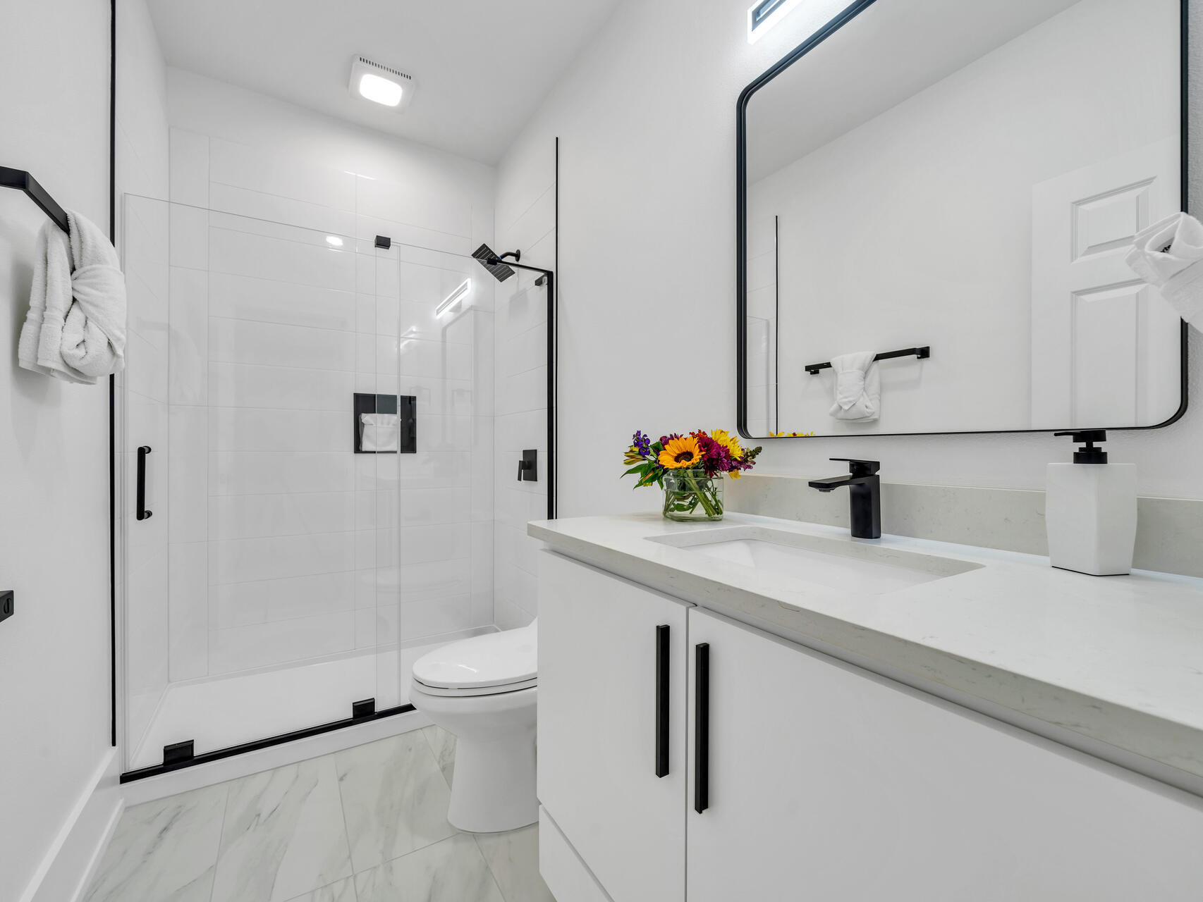 84 Mark Street Destin, FL 32541 - Photo 57 of 81 a bathroom with a sink a toilet and shower