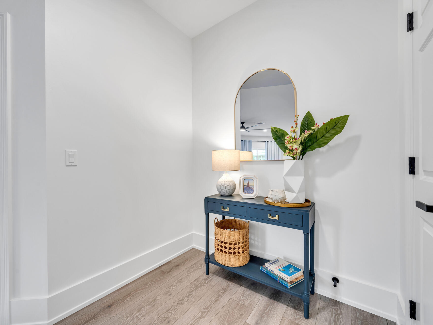 84 Mark Street Destin, FL 32541 - Photo 61 of 81 a room with painting on the wall and a potted plant