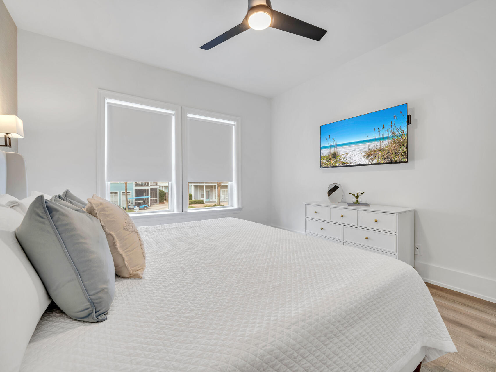 84 Mark Street Destin, FL 32541 - Photo 73 of 81 a bedroom with a bed and a painting on the wall
