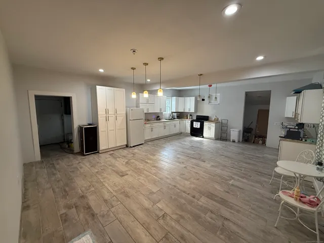 a view of a kitchen and a window