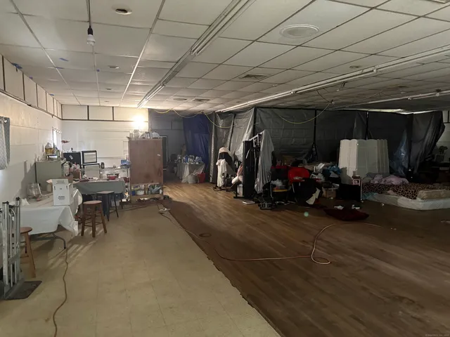 a bathroom with a sink mirror and toilet