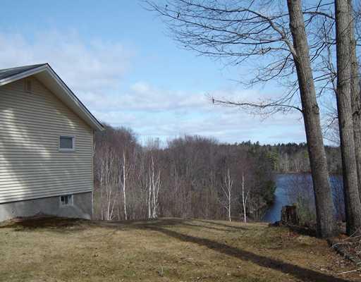 82 Cross Hill Road Augusta, ME 04330 - Photo 20 of 25 Yard/Garden. Side yard with lakeview