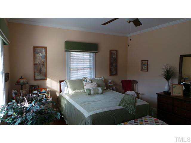 101 Forest Road Oxford, NC 27565 - Photo 13 of 25 This bedroom is 14' 9" by 13', which is a large room. Note the two windows that makes the room light and bright. The room also has a ceiling fan with light. The flooring is hardwood.
