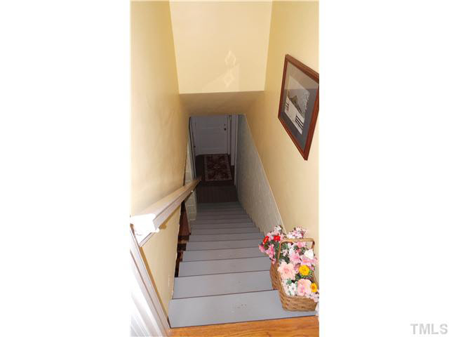 101 Forest Road Oxford, NC 27565 - Photo 15 of 25 Opening off the hallway, this shows the stairs to the basement where there is a fourth bedroom and a full bath. This also leads to the laundry room and garage.