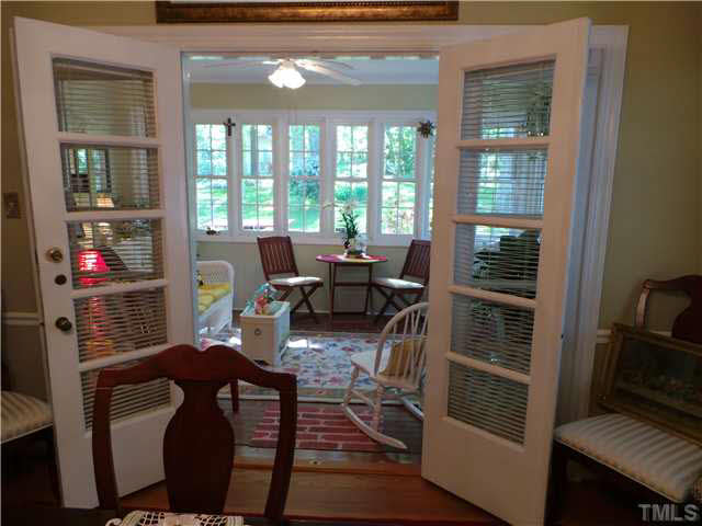 101 Forest Road Oxford, NC 27565 - Photo 18 of 25 The Dining Room opens into the Sun Room through the double French door. The room is not heated or cooled, but with the doors open, the Sun Room can easily be used most of the year, except in extreme cold times. With all the windows, it is a bright room.