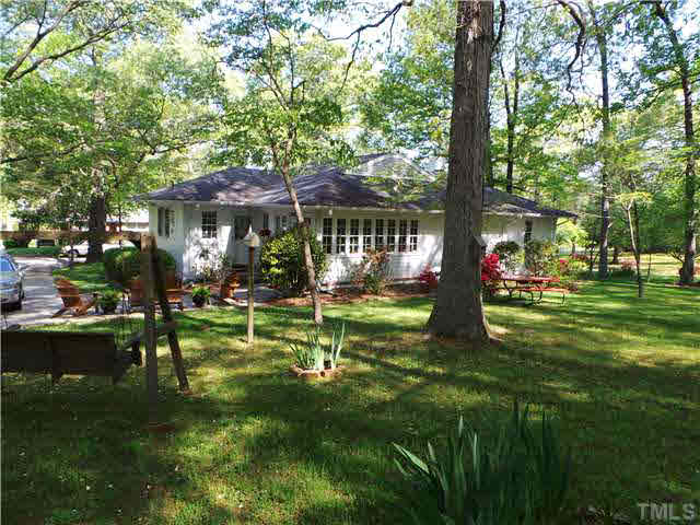 101 Forest Road Oxford, NC 27565 - Photo 22 of 25 This view is of the back of the home from the back yard. The roof has architectural shingles and the main heat pump was replaced three years ago.