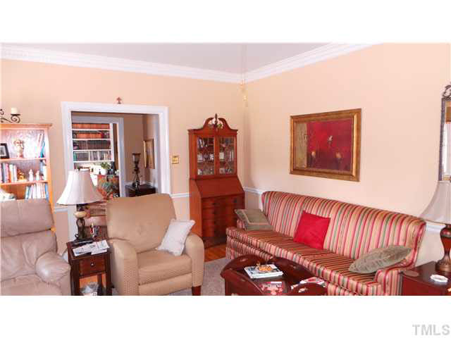 From the corner of the Living Room, this view shows the room from a different perspective.  The opening is to the Foyer, which is 7' 6" by 6' 10".  The second opening through the Foyer shows the study/library.
