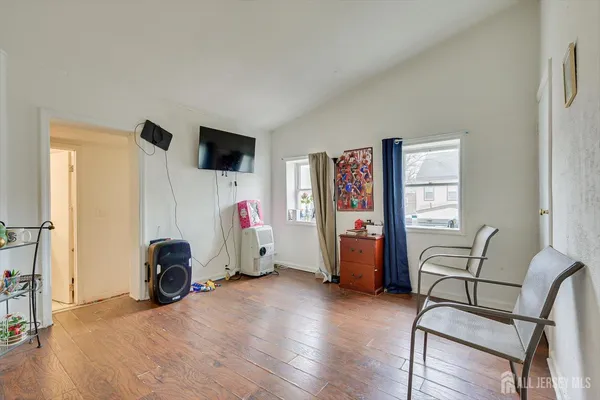 a living room with furniture and a chair