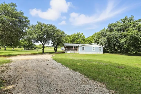 a view of a house with a big yard