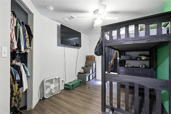 a view of a livingroom with furniture and hardwood floor