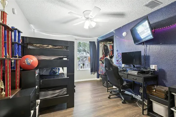 a view of a workspace with furniture and chandelier