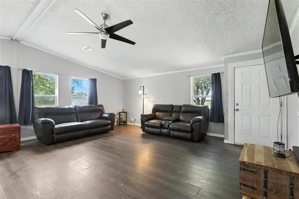 a living room with furniture and a window