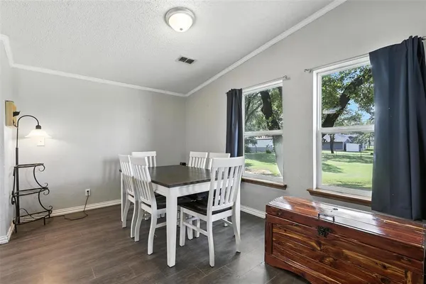 a view of a dining room with furniture window and outside view