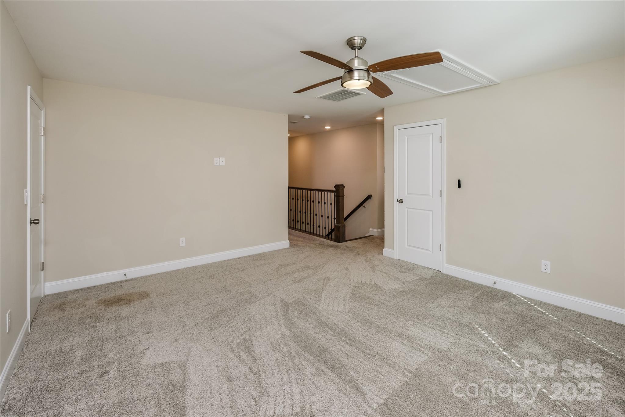 707 Marion Drive Matthews, NC 28105 - Photo 17 of 30 an empty room with a ceiling fan and a window