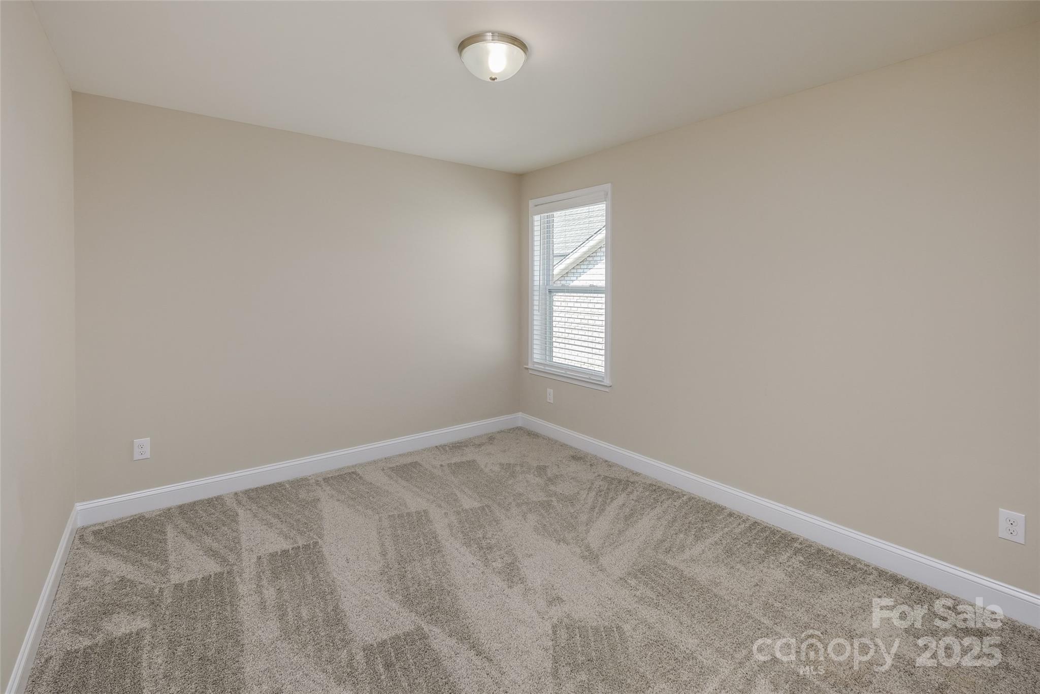 707 Marion Drive Matthews, NC 28105 - Photo 18 of 30 an empty room with windows