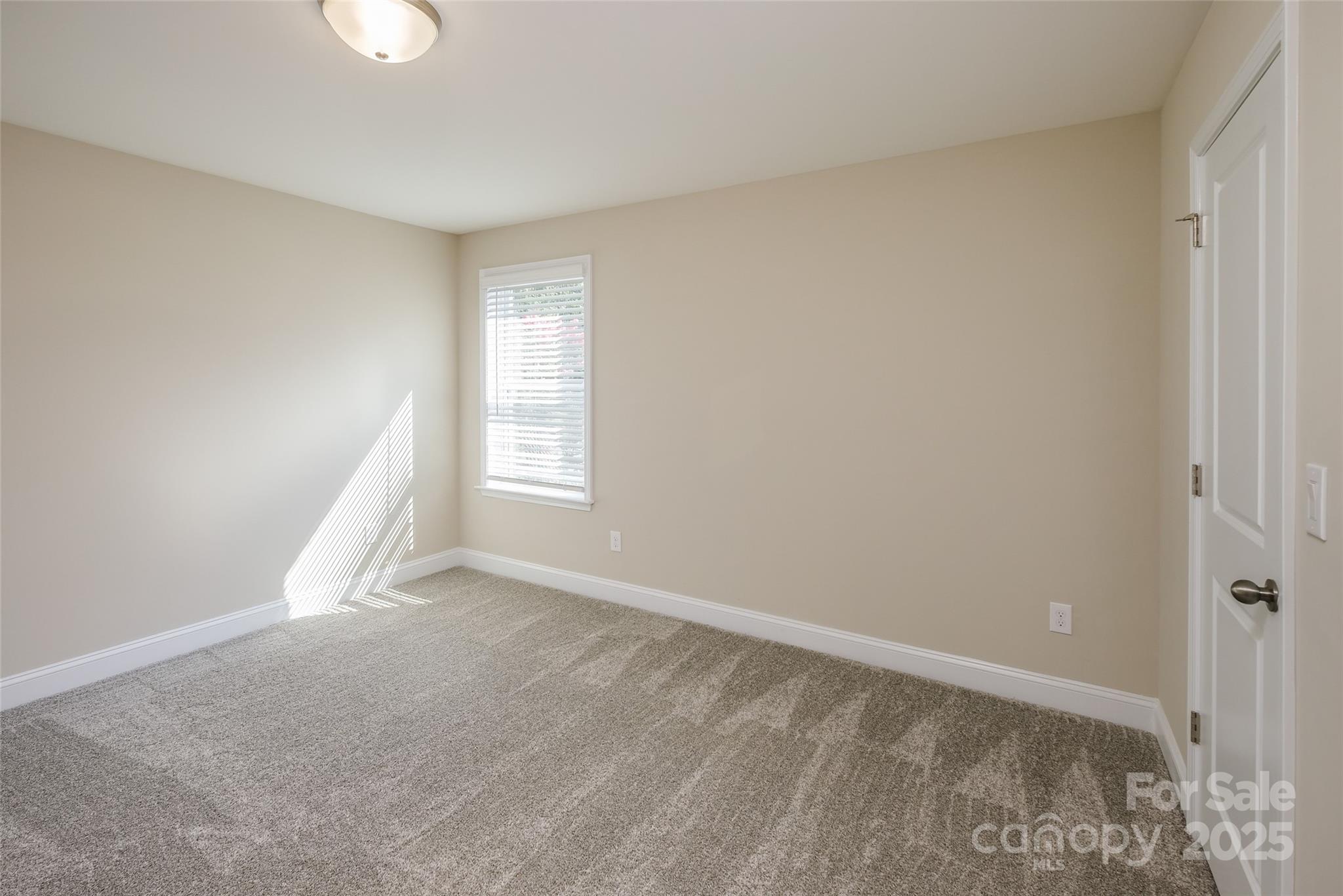 707 Marion Drive Matthews, NC 28105 - Photo 20 of 30 an empty room with windows