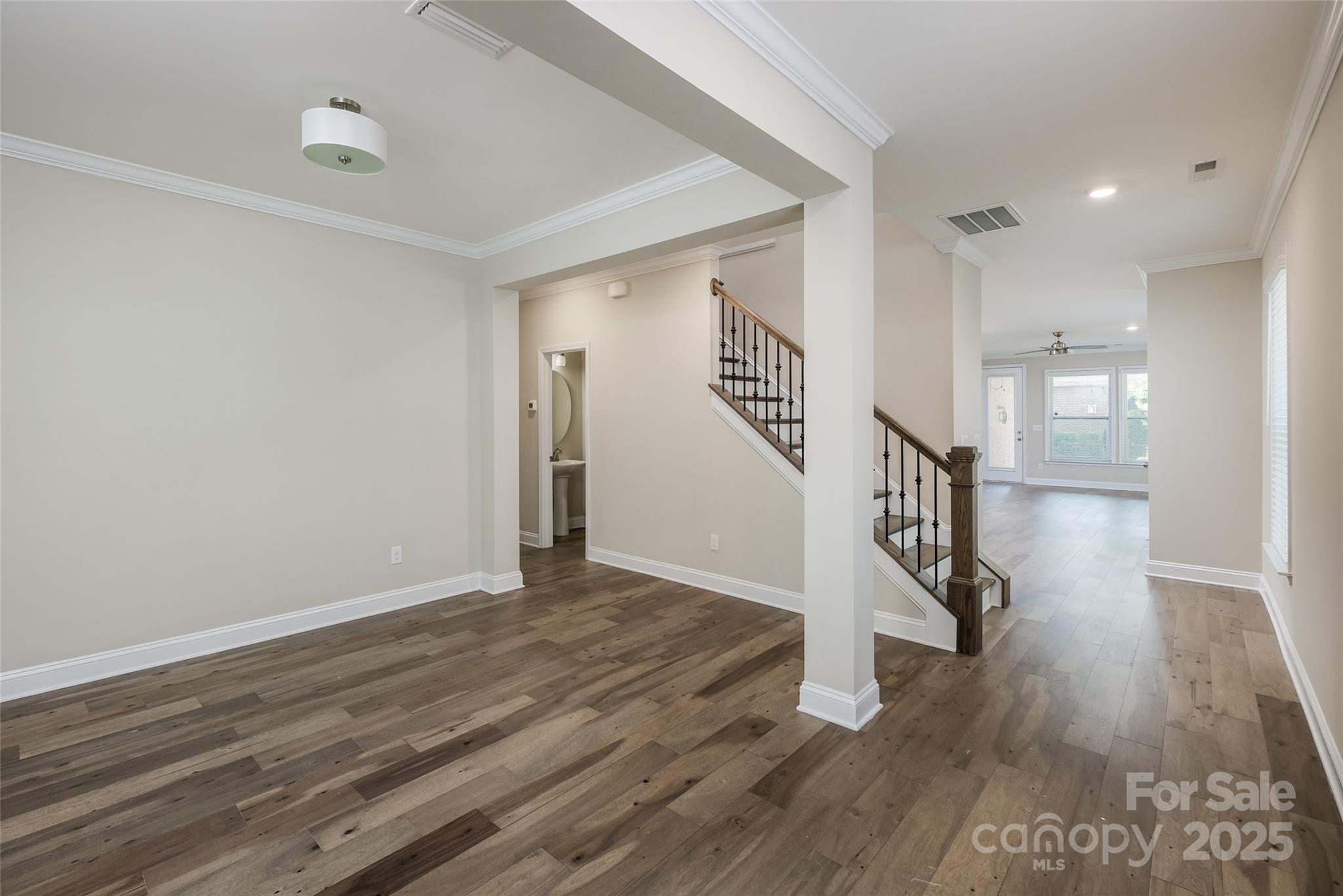 707 Marion Drive Matthews, NC 28105 - Photo 2 of 30 a view of entryway with wooden floor