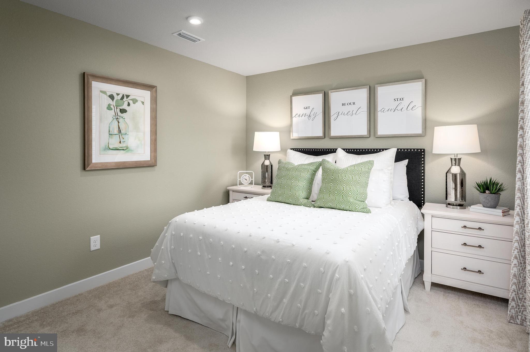 660 Jack Nicholas Circle York, PA 17403 - Photo 17 of 20 a bedroom with a bed and a night stand