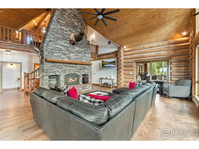 a living room with granite countertop furniture and a fireplace