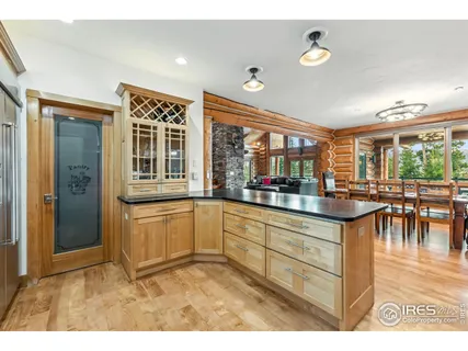 a kitchen with counter top and dining table