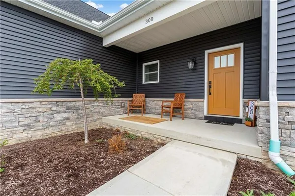 a backyard of a house with outdoor seating