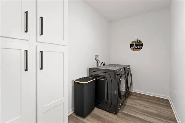 a view of storage and utility room with washer and dryer