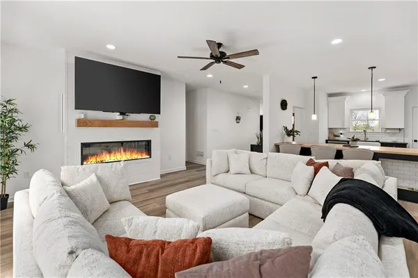 a living room with furniture and a flat screen tv