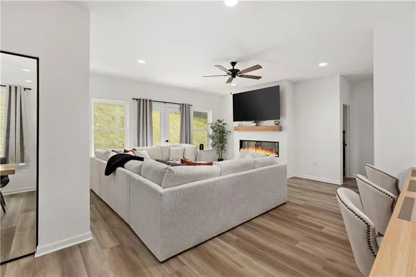 a living room with furniture fireplace and flat screen tv
