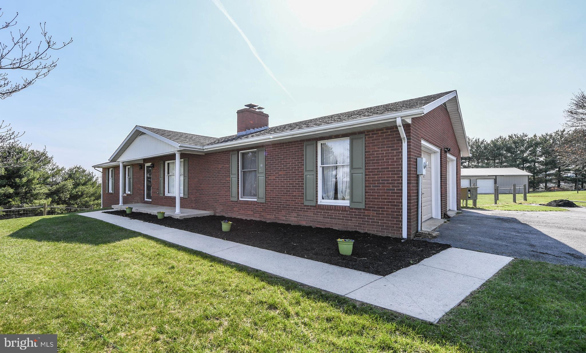 13230 Independence Road Clear Spring, MD 21722 - Photo 1 of 30 a front view of a house with a yard