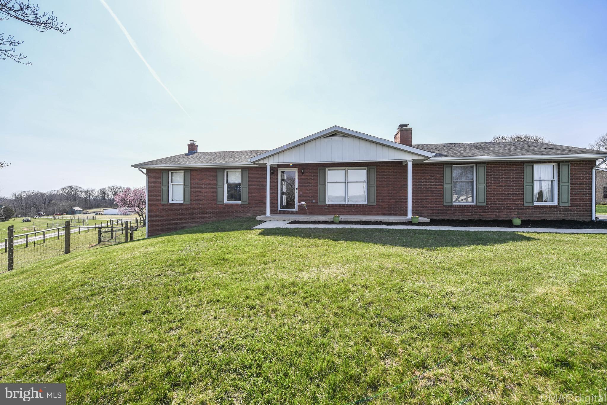 13230 Independence Road Clear Spring, MD 21722 - Photo 2 of 30 a front view of a house with a garden and lake view