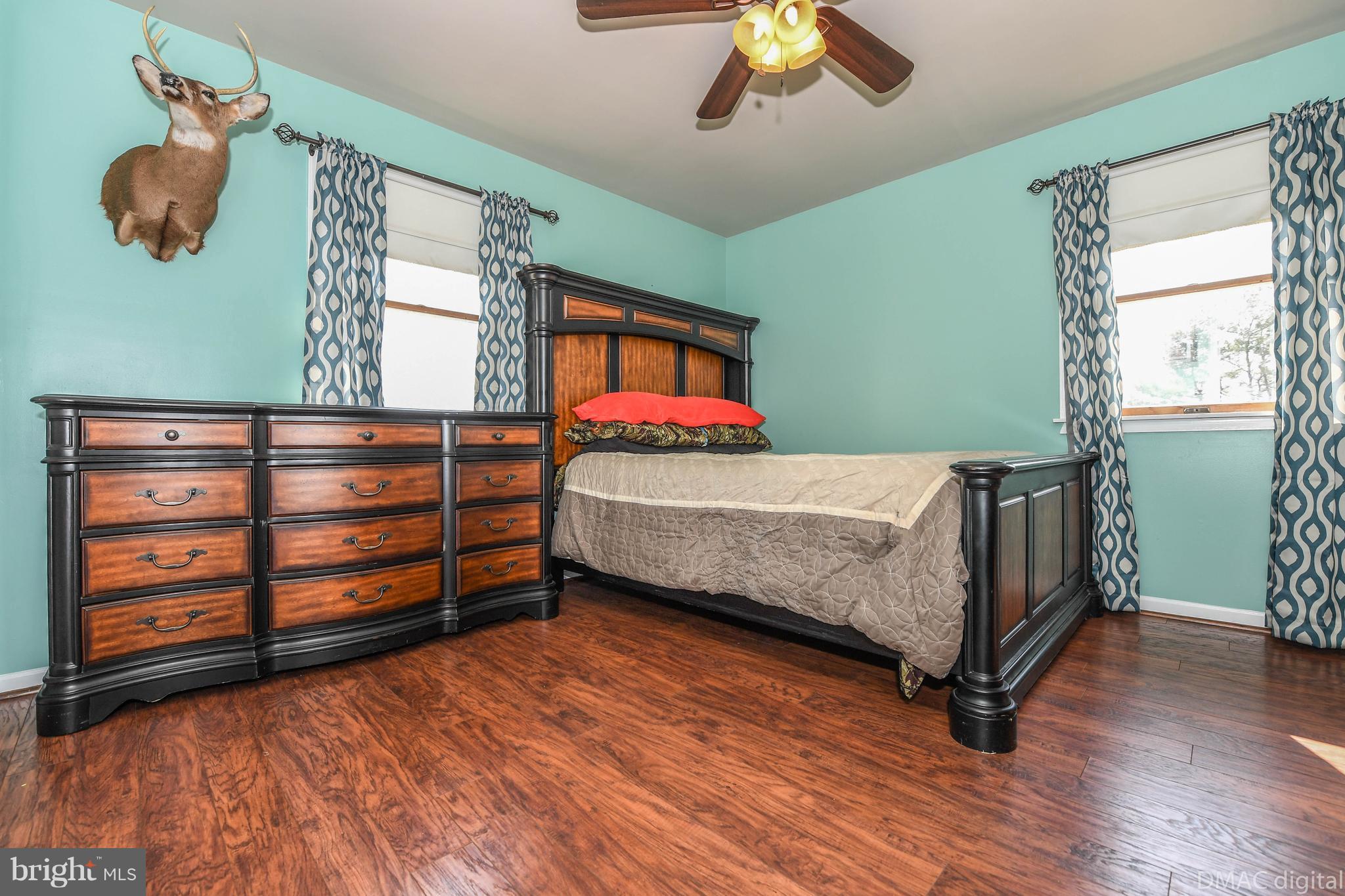 13230 Independence Road Clear Spring, MD 21722 - Photo 11 of 30 a bedroom with a bed and a dresser