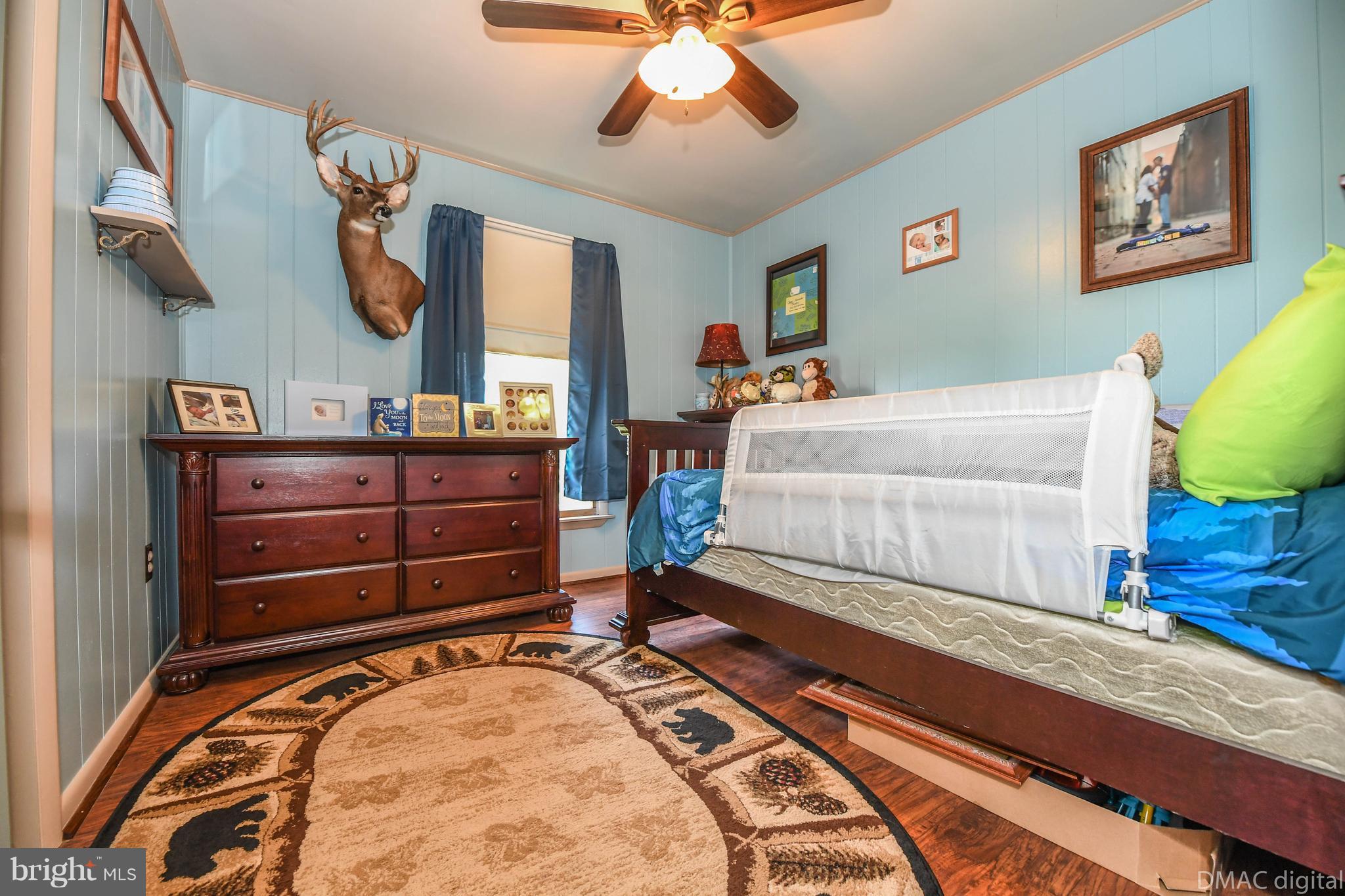 13230 Independence Road Clear Spring, MD 21722 - Photo 13 of 30 a bedroom with a bed and a chandelier