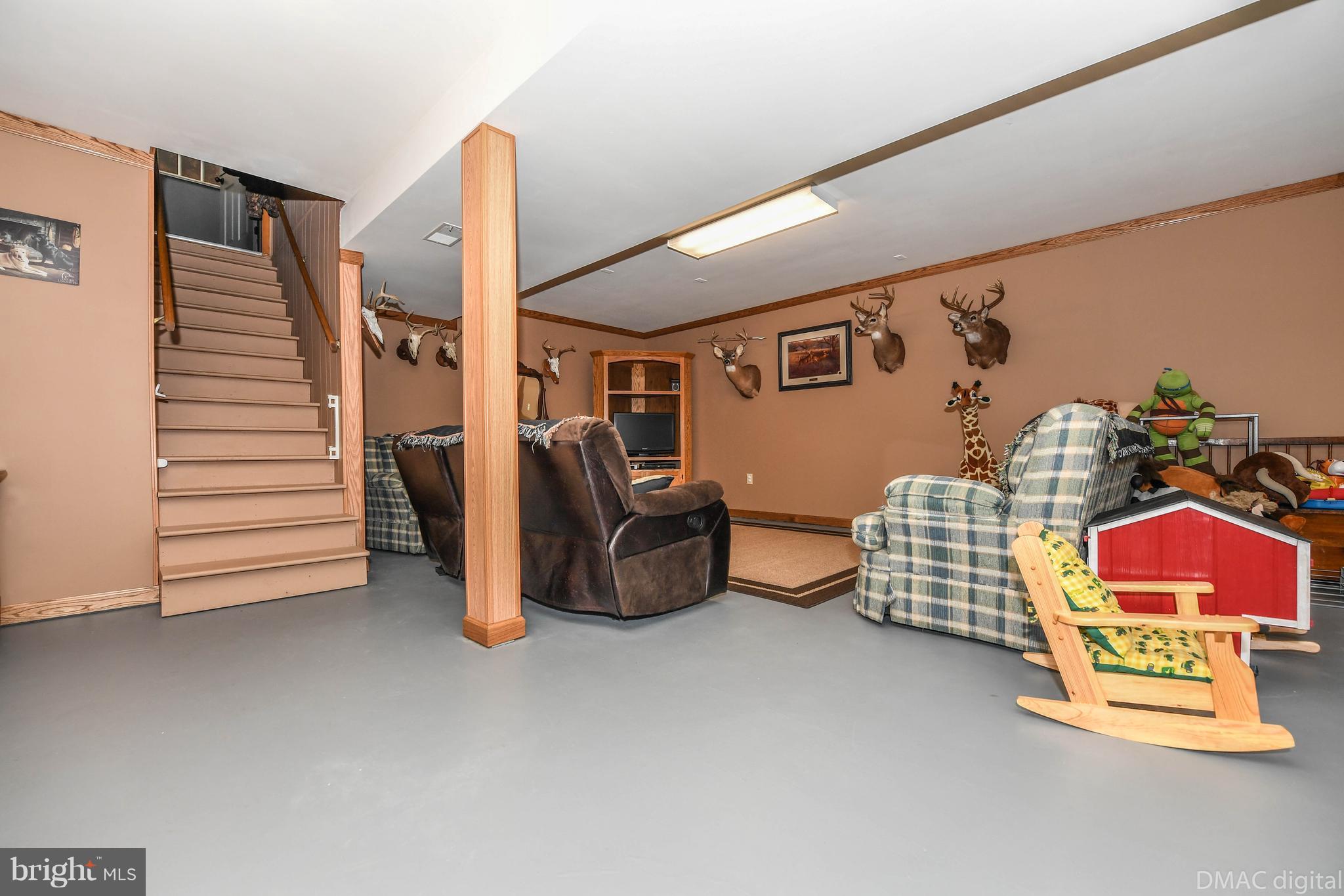 13230 Independence Road Clear Spring, MD 21722 - Photo 15 of 30 a view of an empty room with stairs and a couch